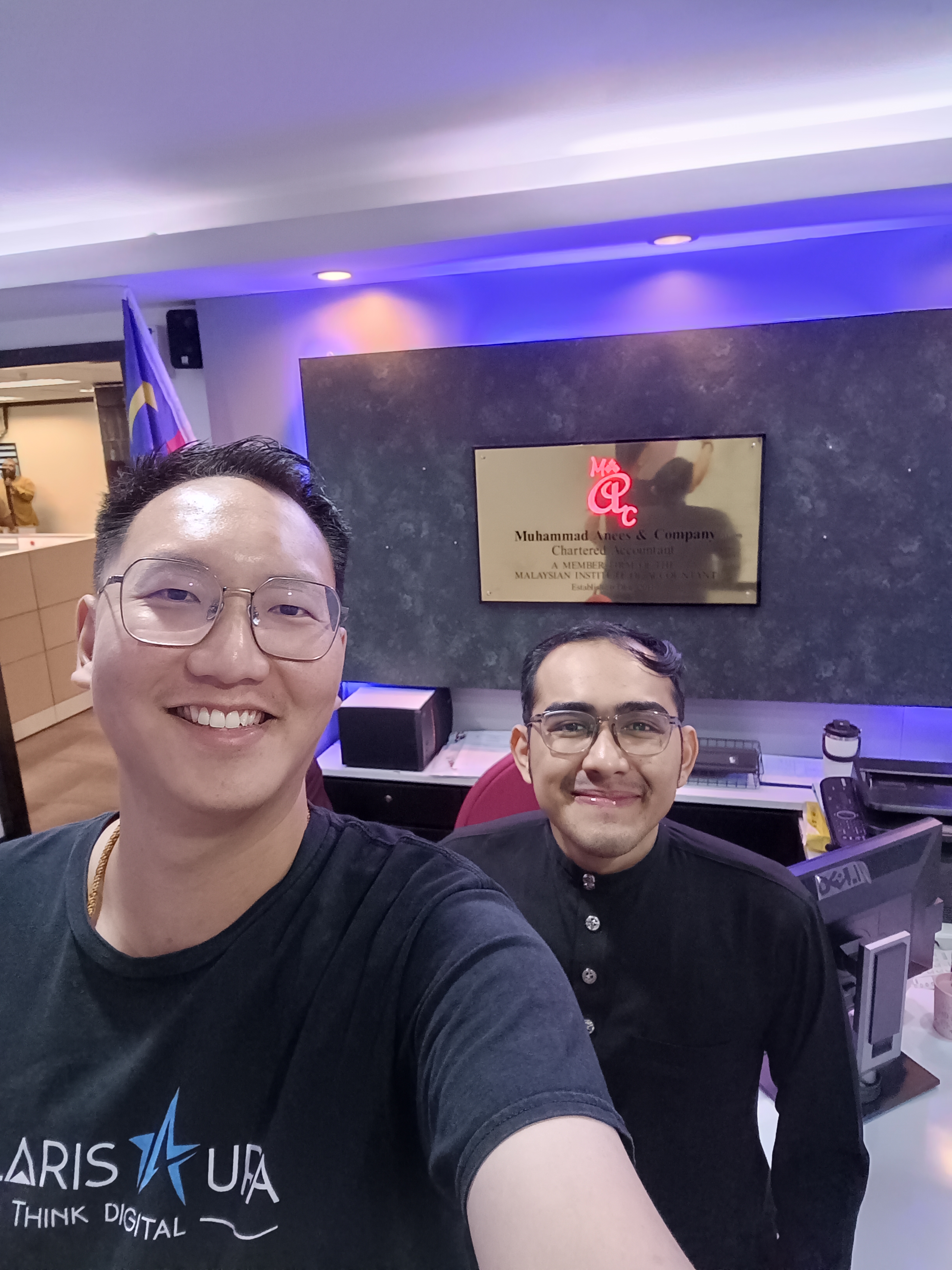 Polar Beh with a colleague at Muhammad Ameer and Company.